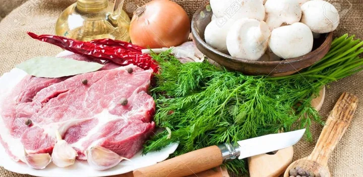 Meat, eggs, onions, garlic and mushrooms illustrating the static food category